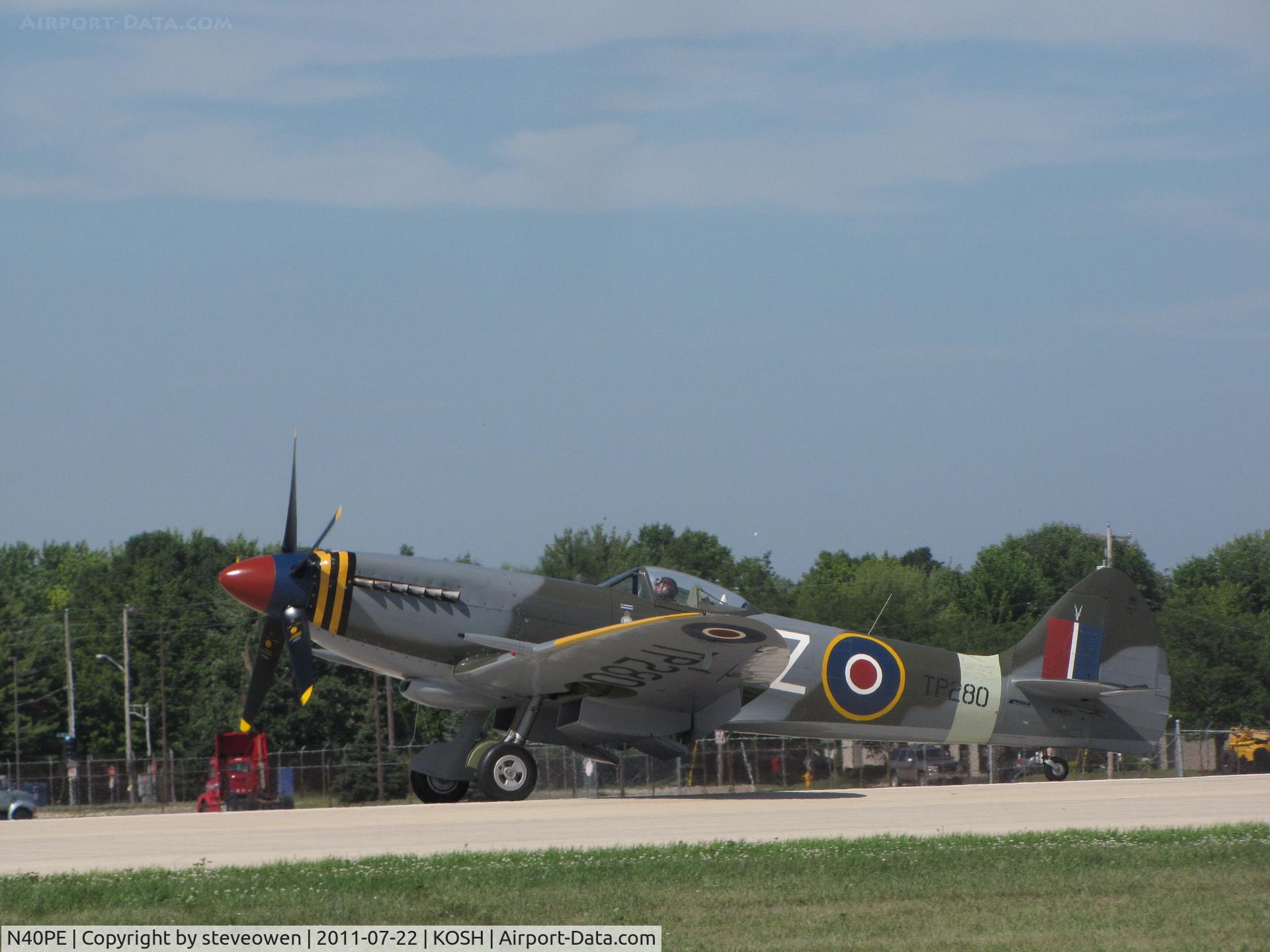 N40PE, 1942 Curtiss P-40E C/N AK905, Landing Rwy 27 @ KOSH during EAA2011