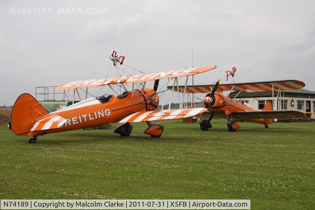 N74189, 1941 Boeing PT-17/R985 Kaydet (A75N1) C/N 75-717, Stearman PT-17 together with B-75N SE-BOG on a refuelling stop at Fishburn Airfield, July 2011.
