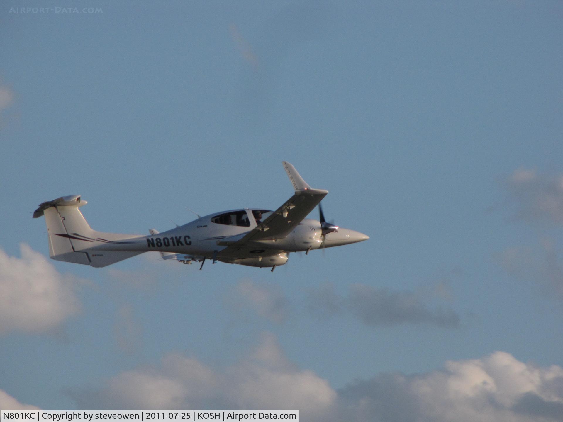 N801KC, 2007 Diamond DA-42 Twin Star C/N 42.AC101, heading into the setting sun EAA 2011