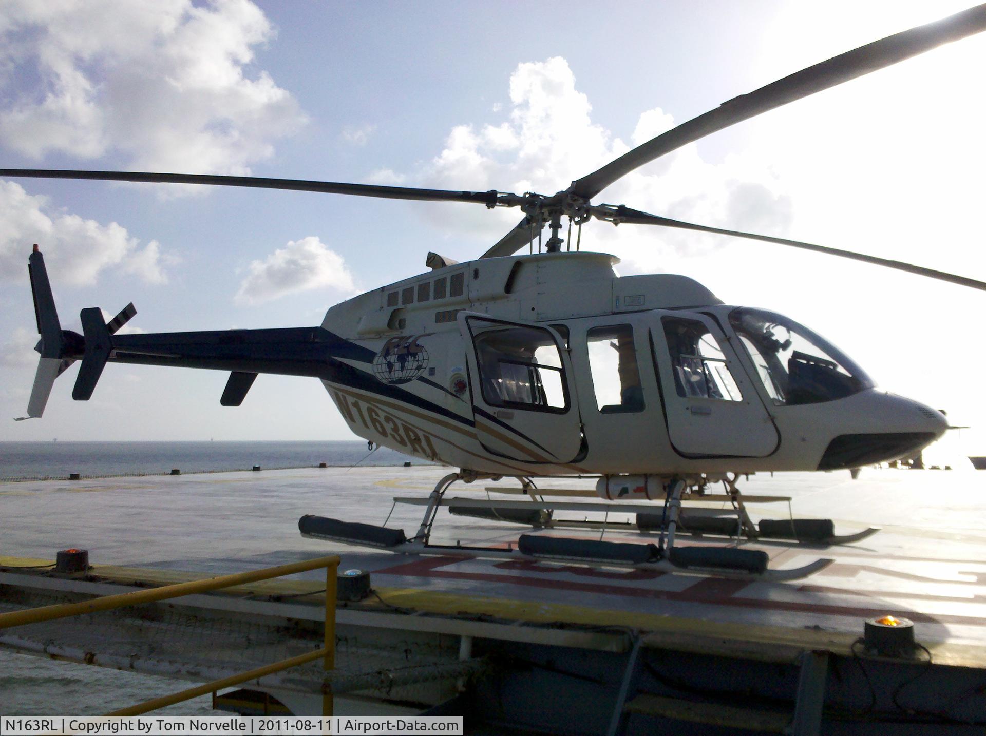 N163RL, Bell 407 C/N 53163, Stand-by at the Ocean New Era Drilling Rig, WC-117 field.