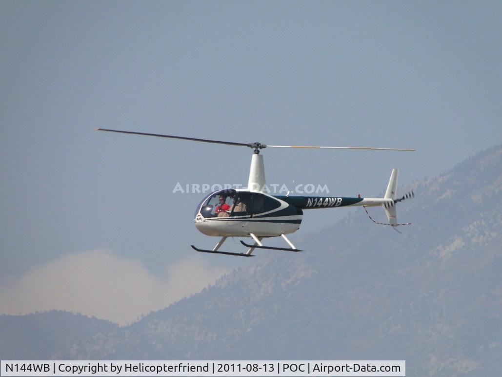 N144WB, 1998 Robinson R44 C/N 0545, On final runway 26L enroute to east side helipad