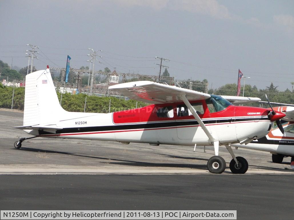 N1250M, 1963 Cessna 180F C/N 18051213, Parked in Howard Aviation parking area