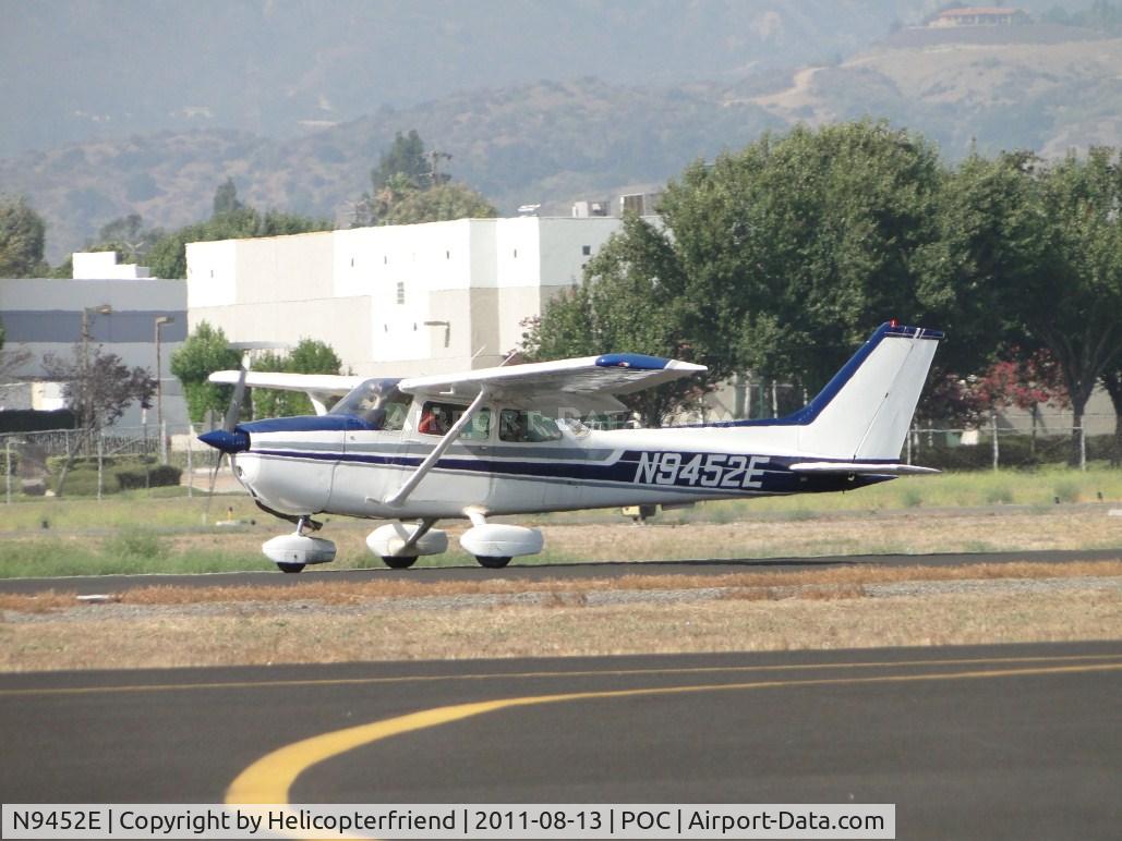 N9452E, 1979 Cessna 172N C/N 17272268, Rolling westbound on runway 26L