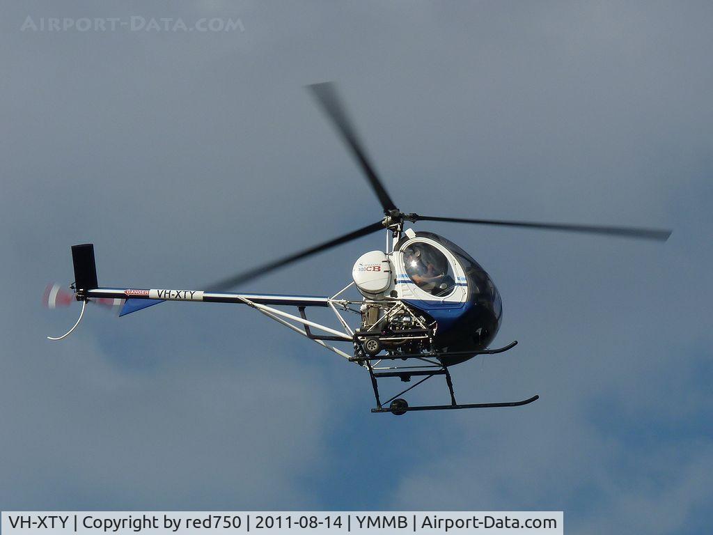 VH-XTY, 1999 Schweizer 269C-1 C/N 0102, Schweizer VH-XTY approaching the helipad at Moorabbin