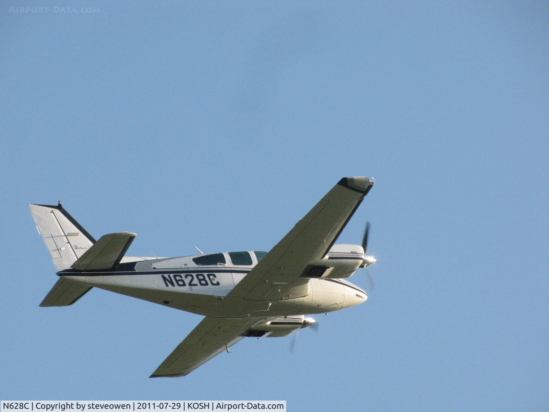 N628C, 1977 Beech 95-B55 (T42A) Baron C/N TC-2052, Departing KOSH   EAA 2011