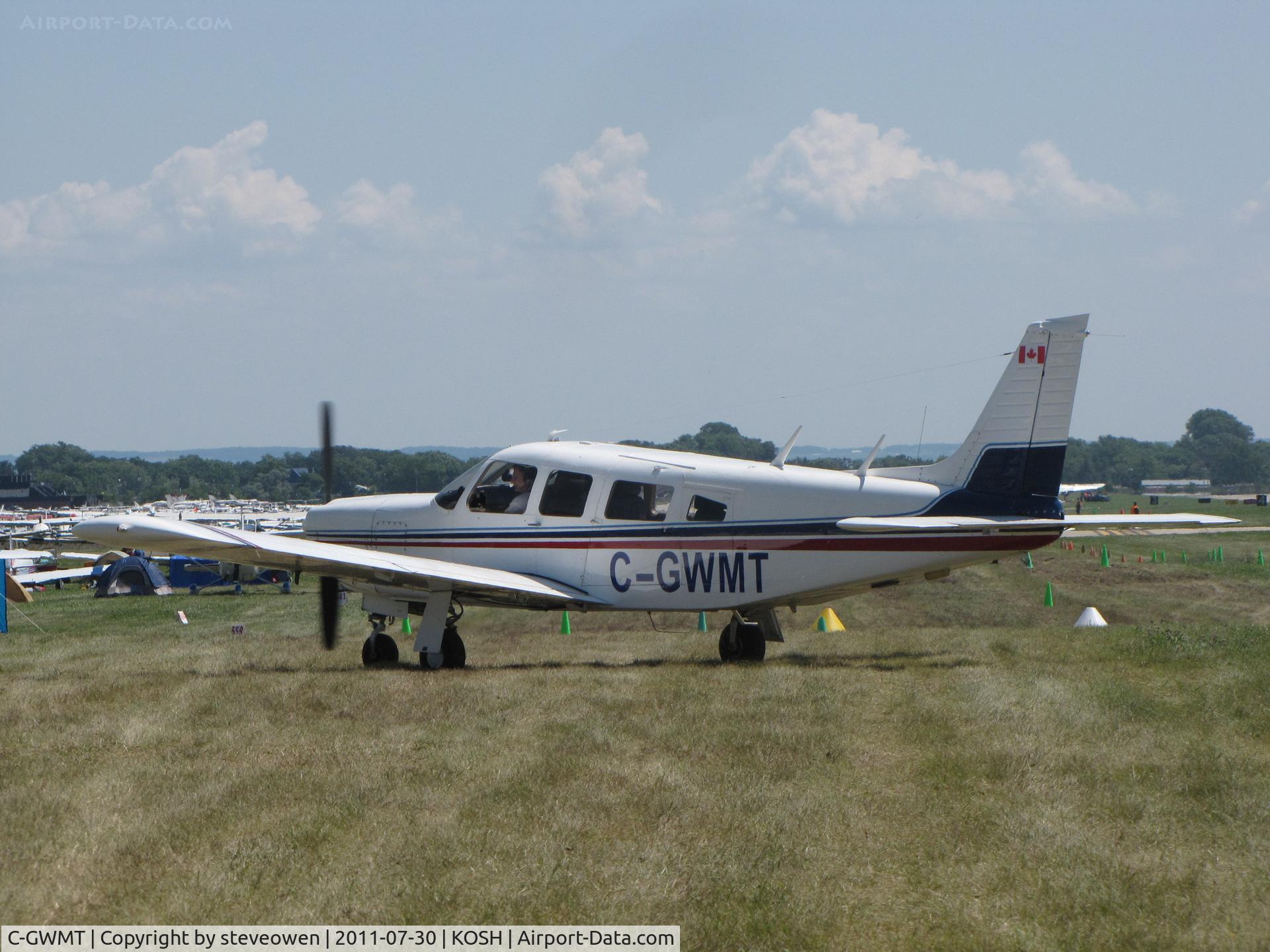 C-GWMT, 1976 Piper PA-32R-300 Cherokee Lance C/N 32R-7680100, taxing out of the GAC Camp grounds EAA 2011