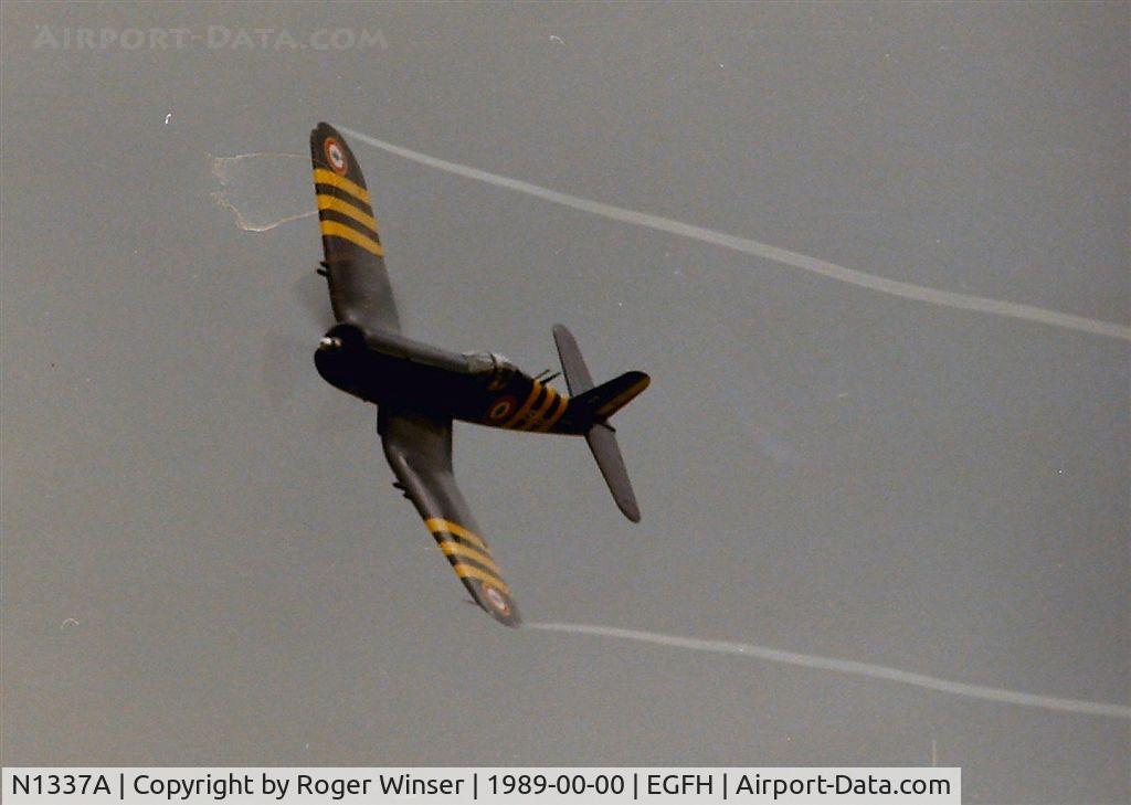 N1337A, 1952 Vought F4U-7 Corsair C/N 977, Corsair in the air at the Swansea Airport Airshow in 1989.