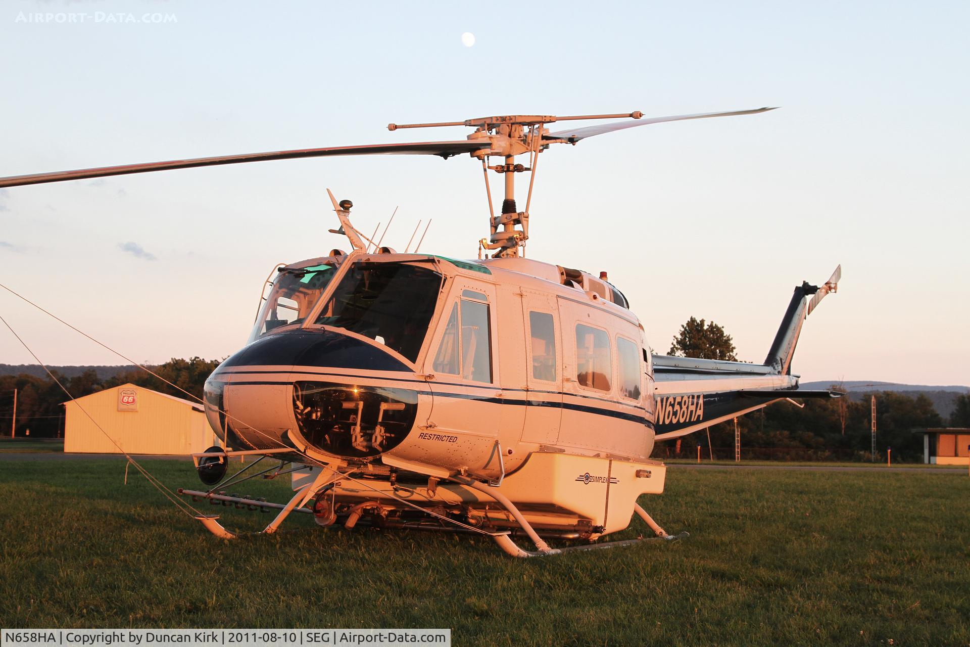 N658HA, 1968 Bell UH-1H C/N 68-15458, A twilight shot of a Huey with the moon out