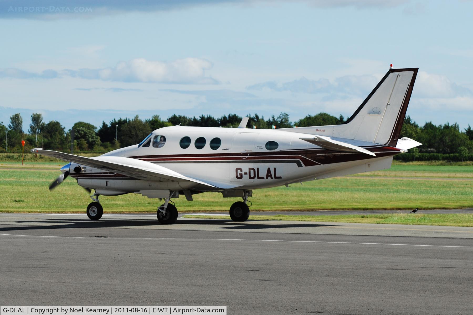 G-DLAL, 1976 Beech E90 King Air C/N LW-187, Taxi-ing to stand.