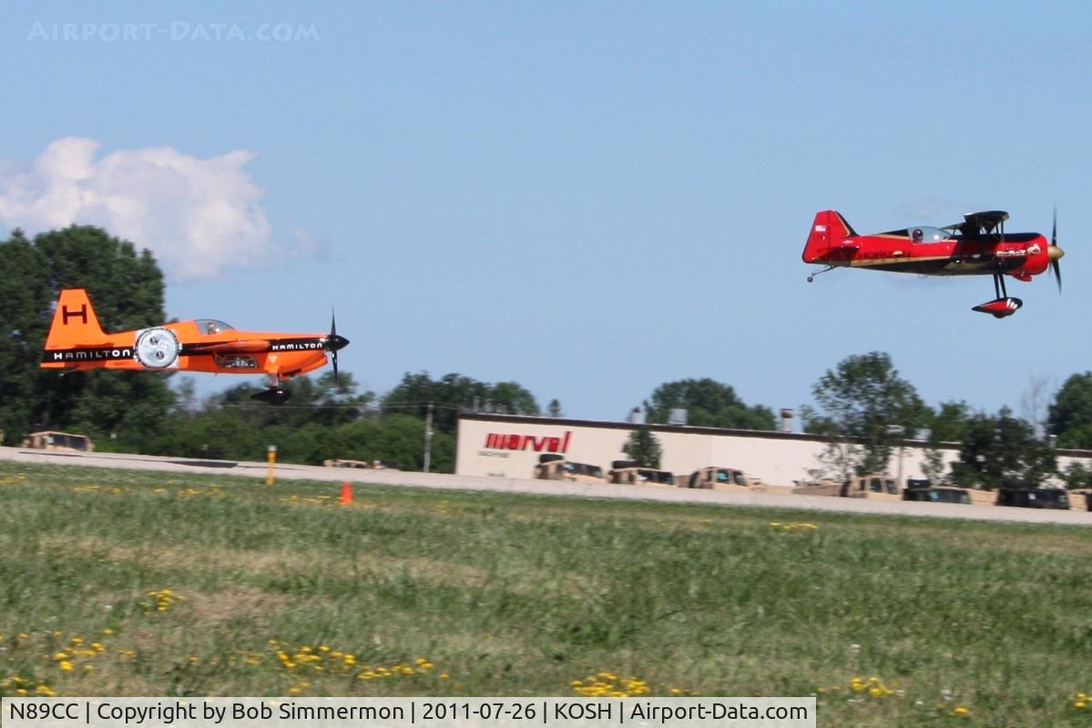 N89CC, 2006 Zivko Edge 540 C/N 0037A, Departing with N2BJ to perform aerobatics at Airventure 2011.