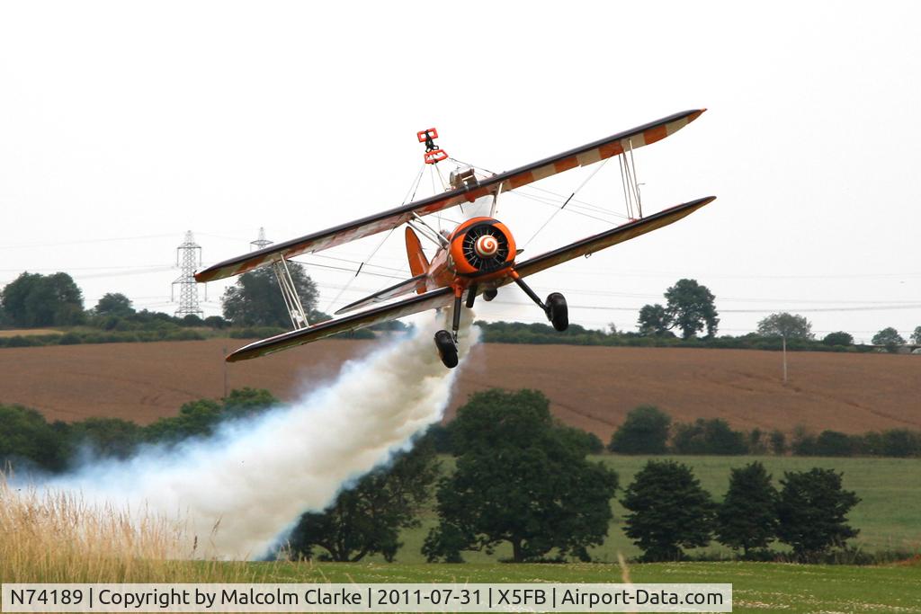 N74189, 1941 Boeing PT-17/R985 Kaydet (A75N1) C/N 75-717, Stearman PT-17 leaves Fishburn Airfield after a refuelling stop, July 2011.