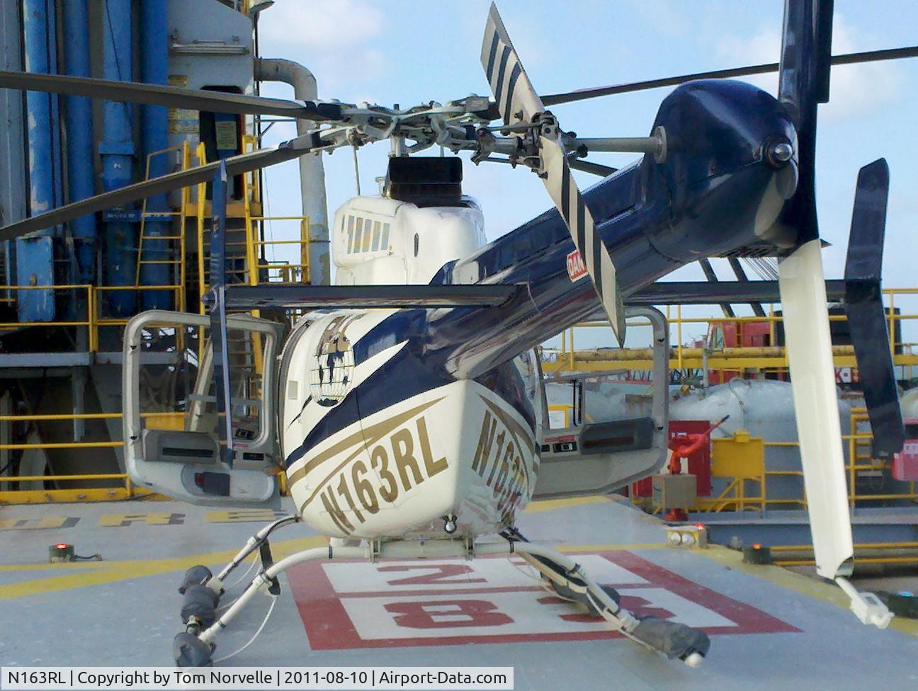 N163RL, Bell 407 C/N 53163, N163RL on the deck at the Ocean New Era Drilling Rig.