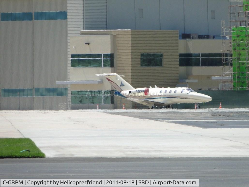 C-GBPM, 1998 Cessna 525 CitationJet C/N 525-0287, Parked to the rear of Million Air on a hot day