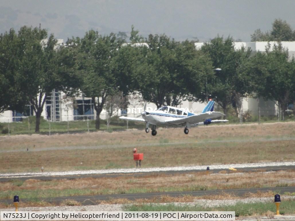 N7523J, 1969 Piper PA-28R-180 Cherokee Arrow C/N 28R-31100, Landing as a gust of wing blows across