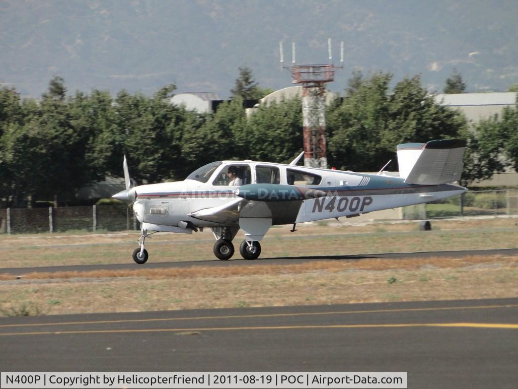 N400P, 1976 Beech V35B Bonanza C/N D-9933, After stopping at Howard Aviation, rolling westbound on runway 26L