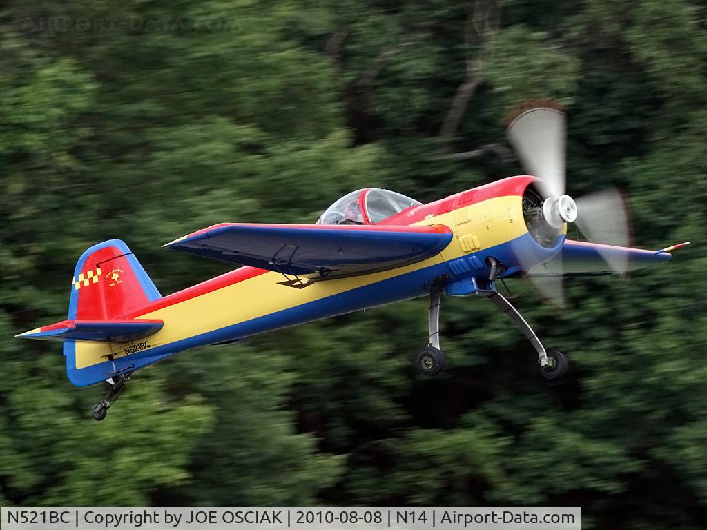 N521BC, 1996 Yakovlev YAK-55M C/N 961007, leaving the Flying W