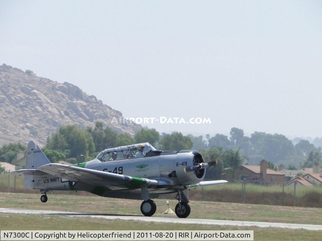 N7300C, 1958 North American AT-6D Harvard II C/N 43763, Touching down, tail wheel still up