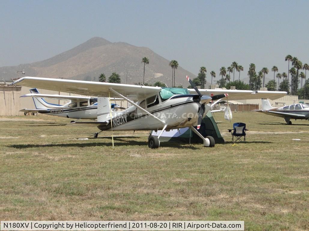 N180XV, 1961 Cessna 180D C/N 18050998, Appears to be camped out while parked in the grass