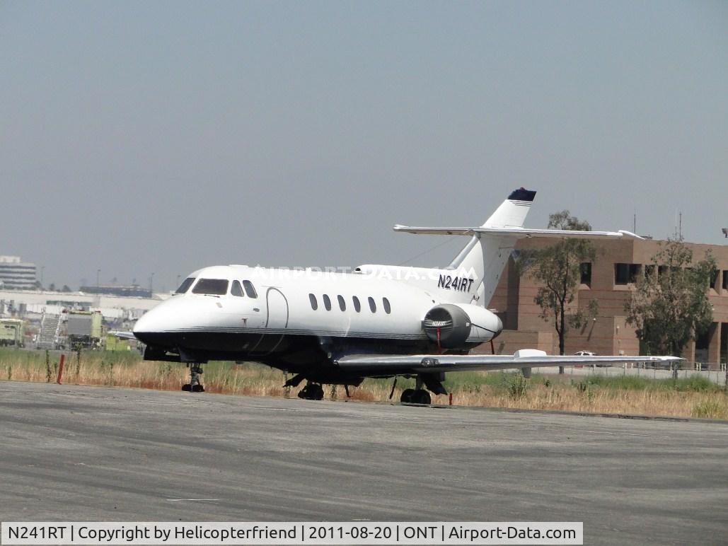 N241RT, 1979 British Aerospace HS 125-700A C/N NA0242, Parked at the east end of a south parking area