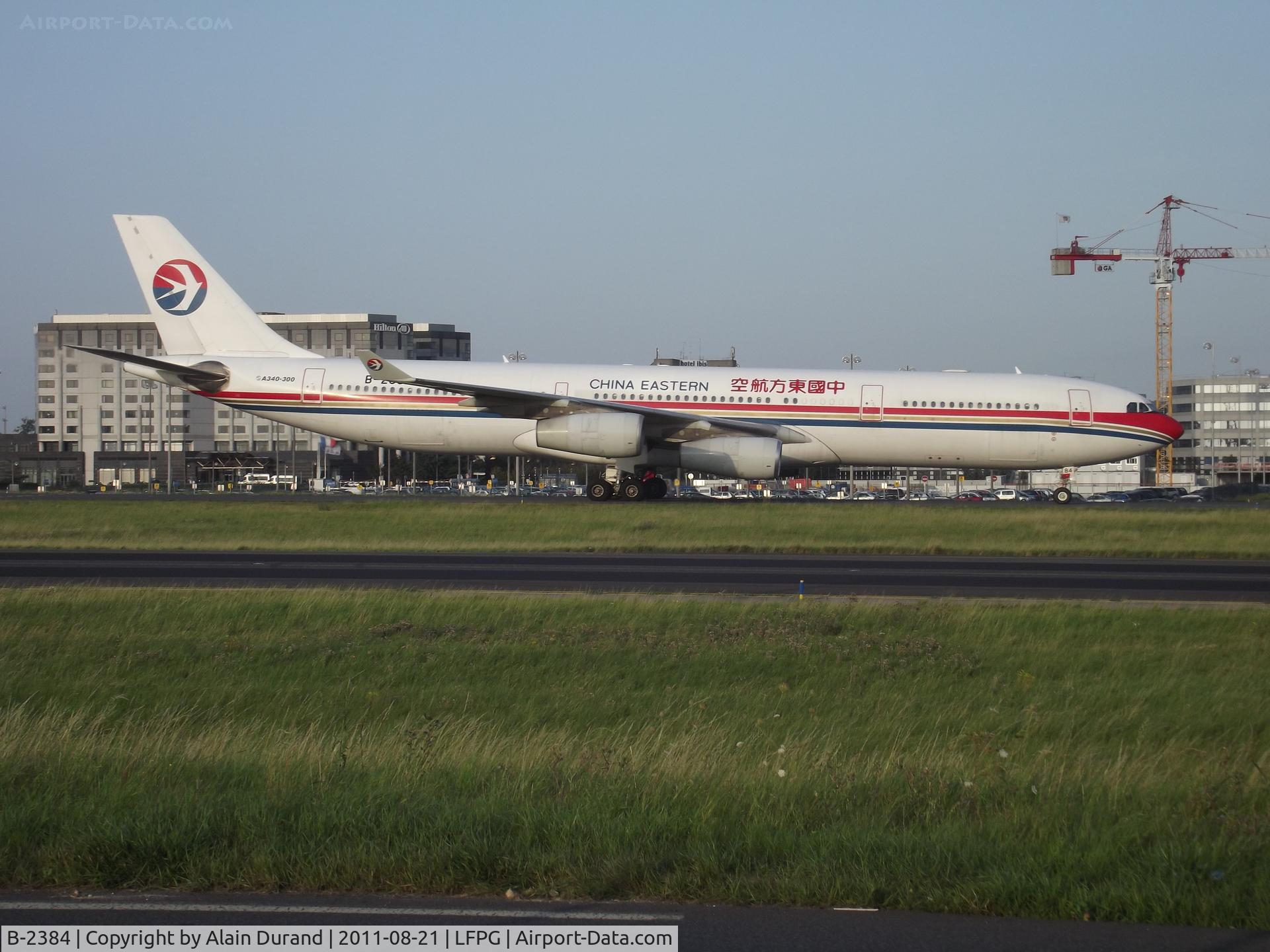 B-2384, 1997 Airbus A340-313 C/N 182, Heading to gate at Terminal 2F