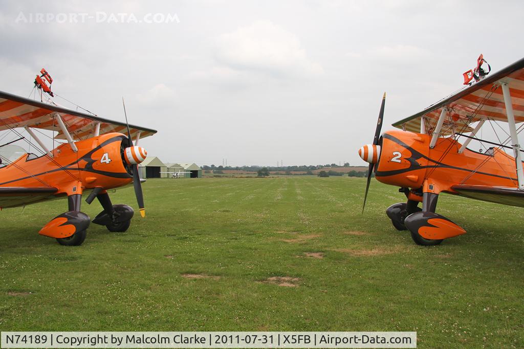 N74189, 1941 Boeing PT-17/R985 Kaydet (A75N1) C/N 75-717, Stearman PT-17 Kaydet, together with B-75N SE-BOG, on a refuelling stop at Fishburn Airfield, July 2011.