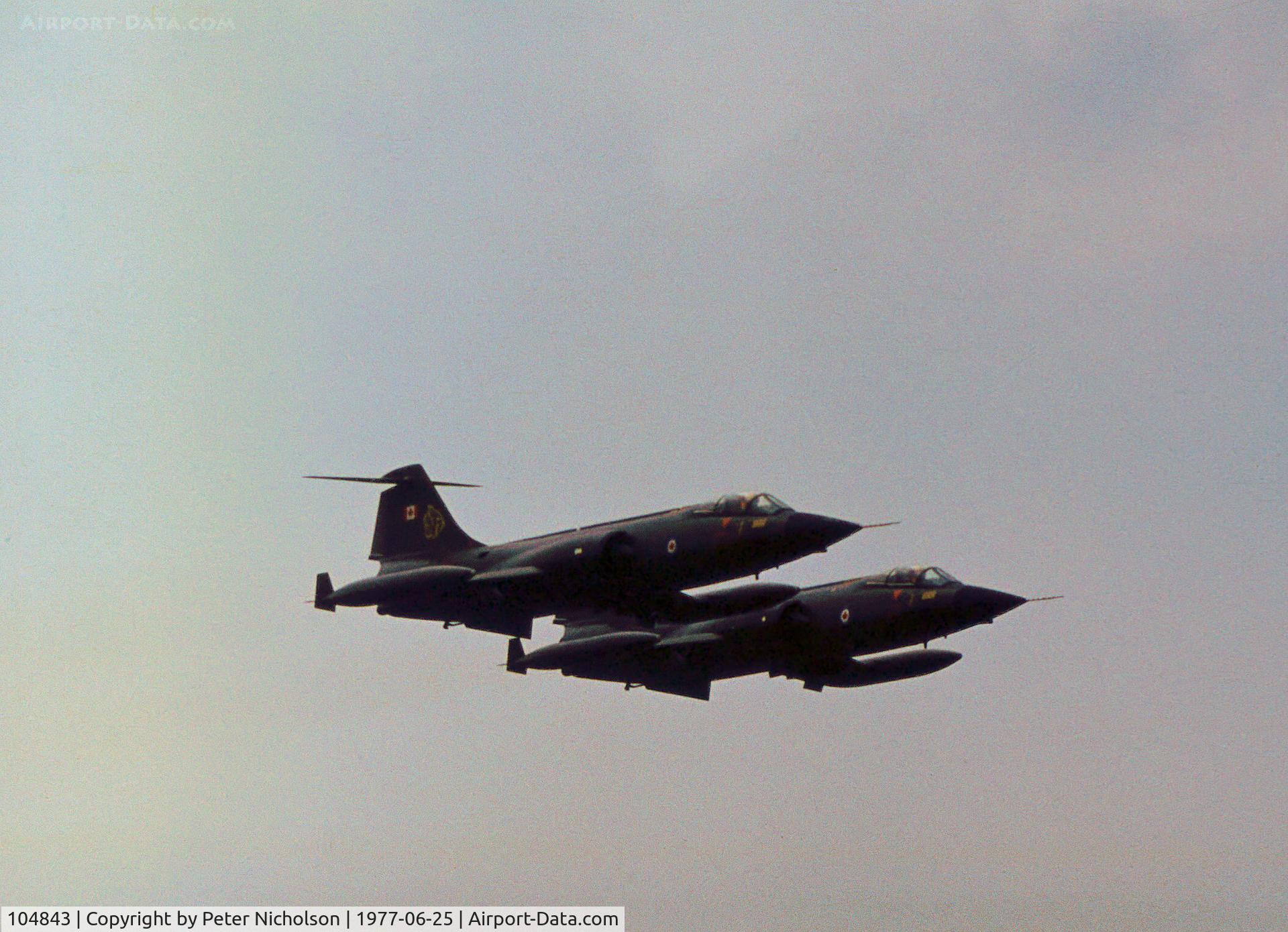 104843, Canadair CF-104 Starfighter C/N 683A-1143, CF-104 Starfighters 104843 and 104751 of 439 Squadron Canadian Armed Forces in action at the 1977 International Air Tattoo at RAF Greenham Common.