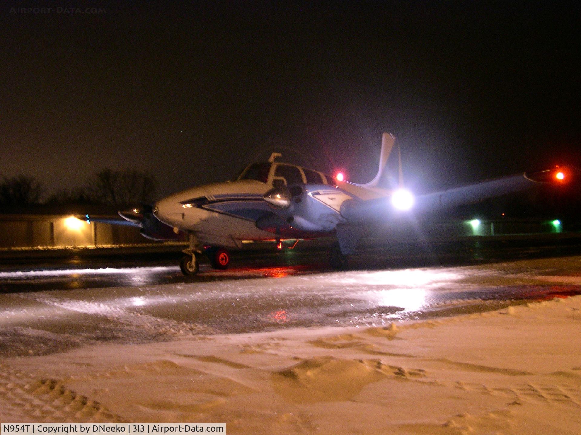 N954T, 1960 Beech B95 Travel Air C/N TD-393, NOT. CENTERED.  ...very frustrated with myself over that... but it was a really cold and damp night and I was freezing.
Formerly N954T, now it's known as N210SK.