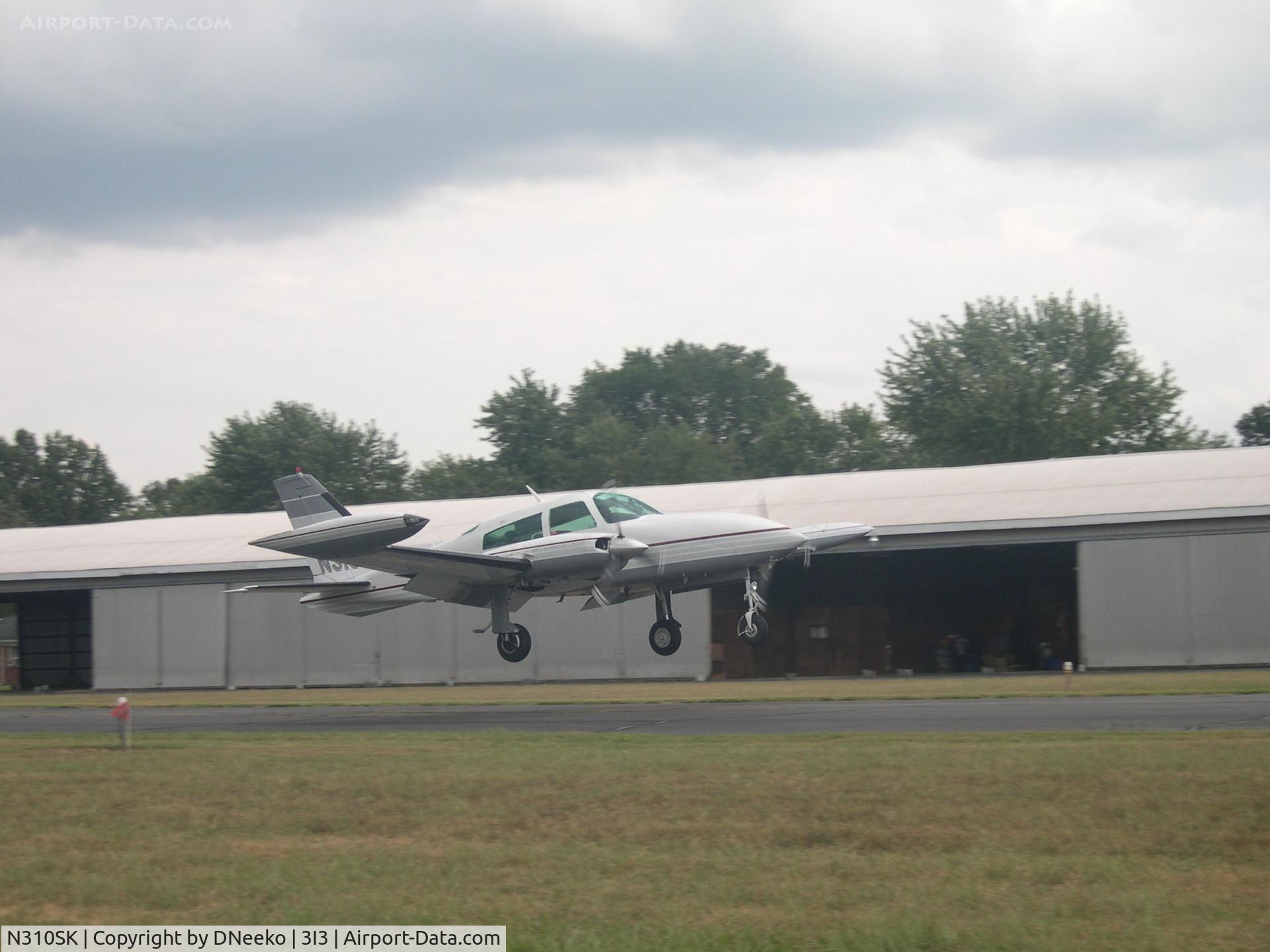 N310SK, 1979 Cessna T310R C/N 310R1829, Landing rwy 26 after a charter flight.
picture isn't centered. photoshop can take care of that, but then it wont meet the criteria for upload.