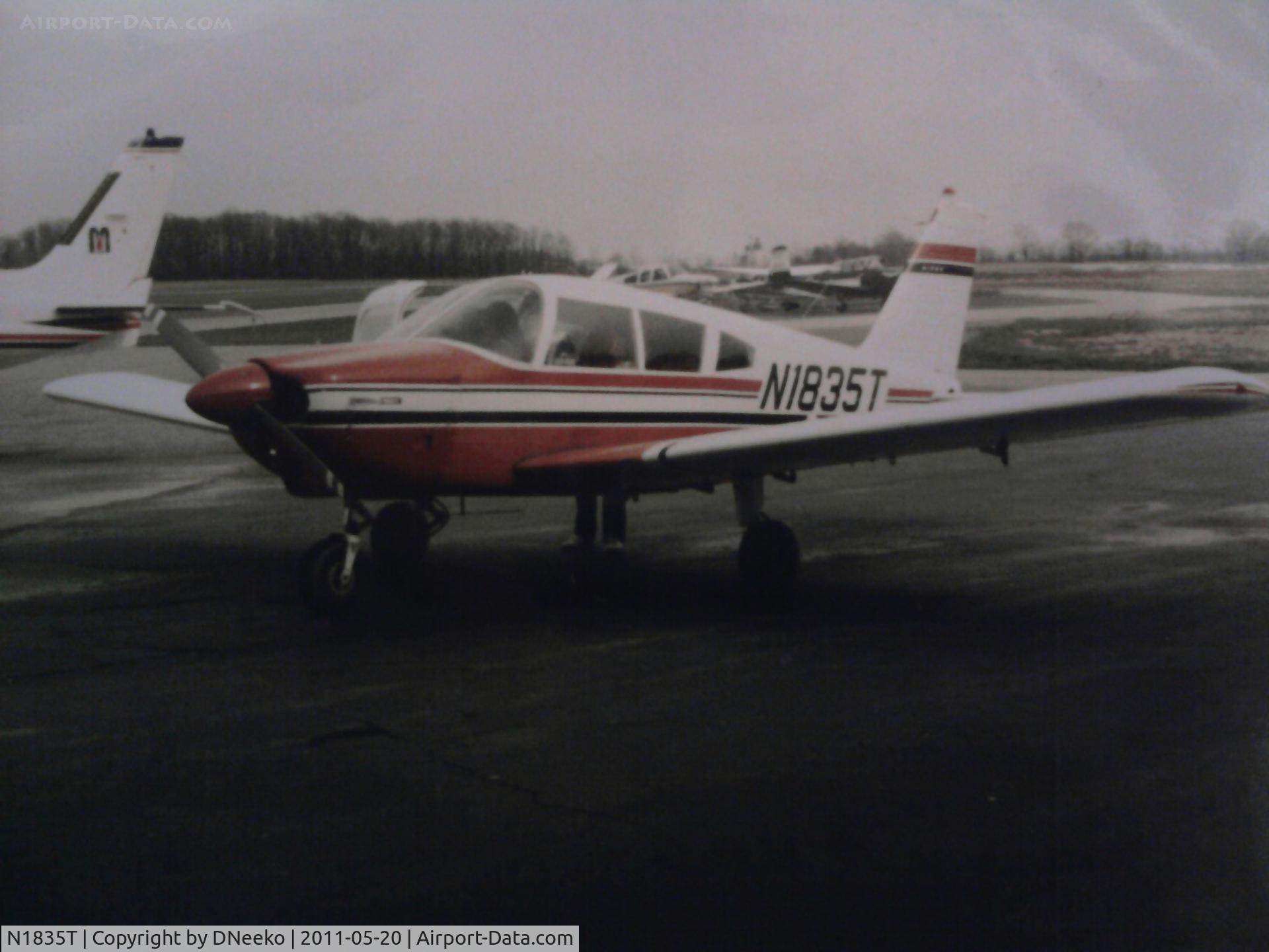 N1835T, 1971 Piper PA-28-180 C/N 28-7105112, The paint job it first came with back in 1971.  Sorry for the quality... its from a 35mm picture and we don't own a scanner.. so I used my phone. This is probably the only picture we have of it before it got its gray and white scheme that it has today
