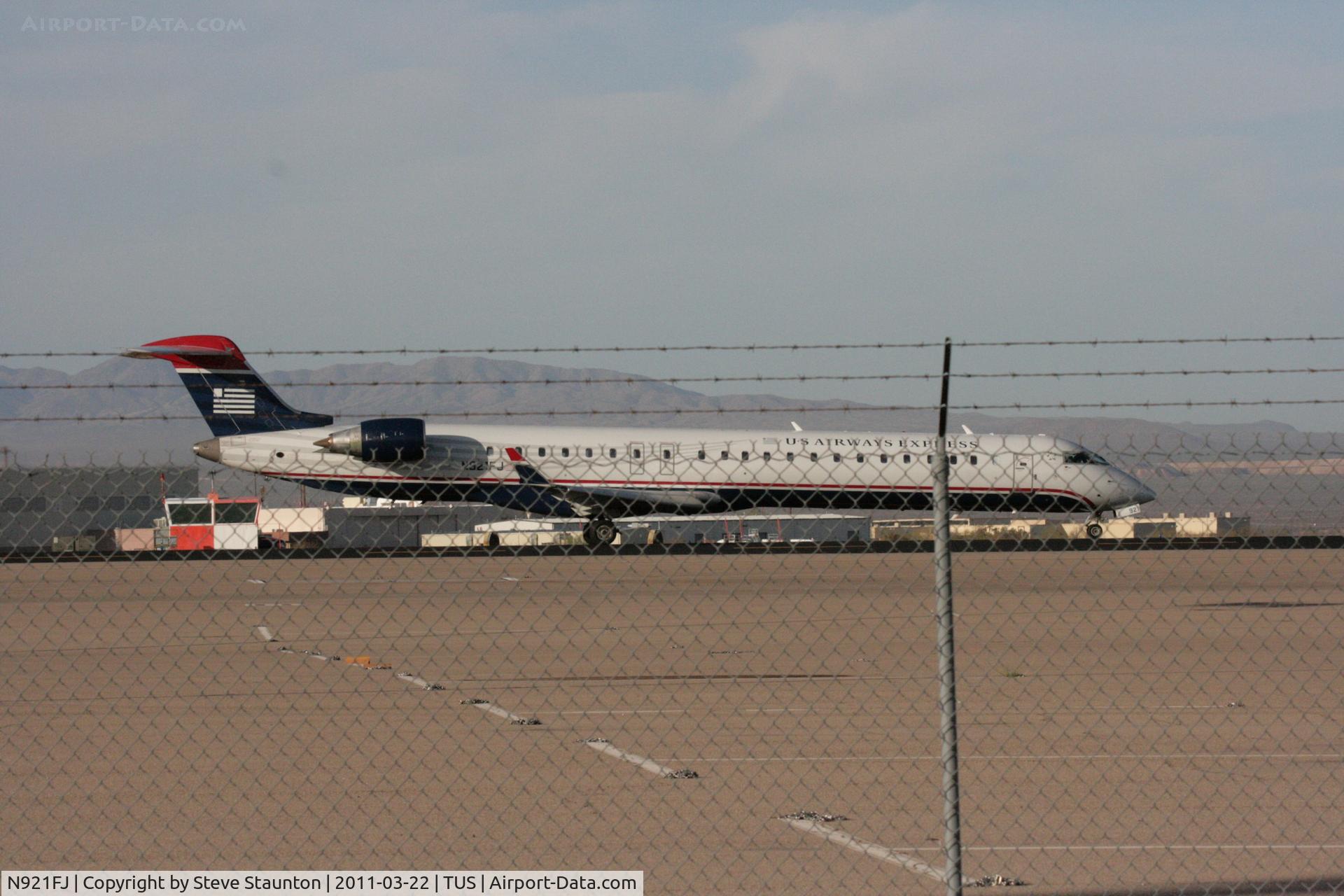 N921FJ, 2004 Bombardier CRJ-900ER (CL-600-2D24) C/N 15021, Taken at Tucson International Airport, in March 2011 whilst on an Aeroprint Aviation tour