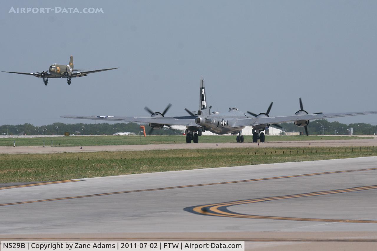 N529B, 1944 Boeing B-29A-60-BN Superfortress C/N 11547, N87745 landing while CAF B-29 FiFi taxi's out for takeoff At Meacham Field - Fort Worth, TX