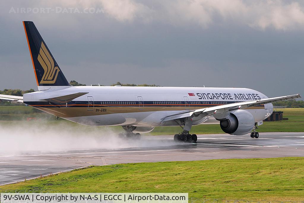 9V-SWA, 2006 Boeing 777-312/ER C/N 34568, Departing a wet MAN