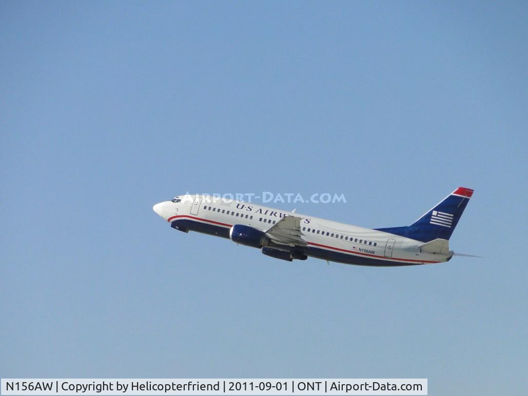 N156AW, 1987 Boeing 737-3G7 C/N 23778, Flt 277 enroute Phoenix, Az is taking off from runway 26R, main gear up and nose wheel door closing