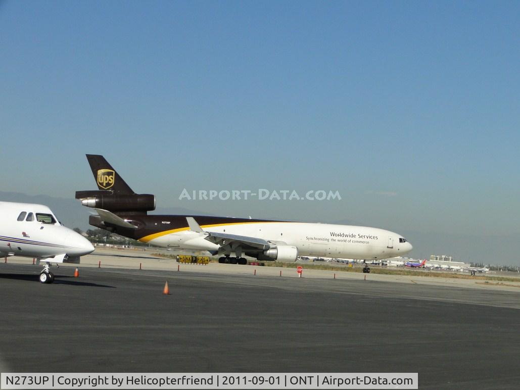 N273UP, 1994 McDonnell Douglas MD-11F C/N 48574, Flt 2918 from Dallas, Tx just landed on runway 26L, turned off runway at taxiway Papa and is heading back to UPS parking area