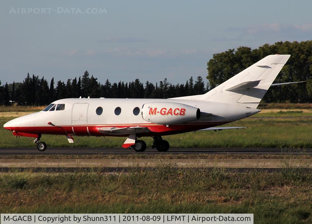 M-GACB, 1974 Dassault Falcon 10 C/N 22, Parked at the General Aviation area...