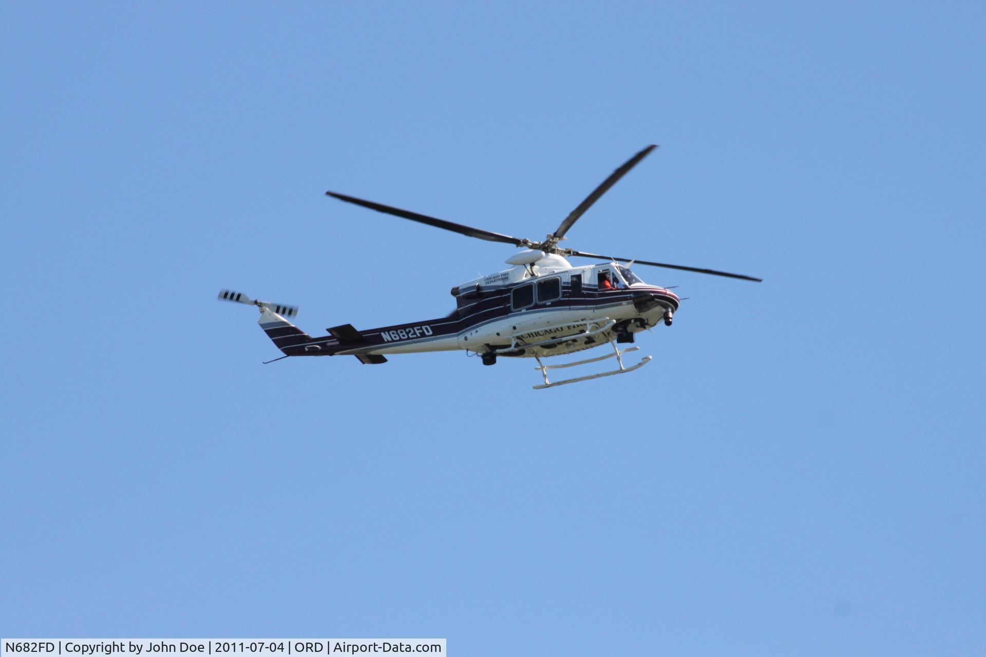 N682FD, 2001 Bell 412EP C/N 36279, In flight over Lake Michigan near 57th street beach