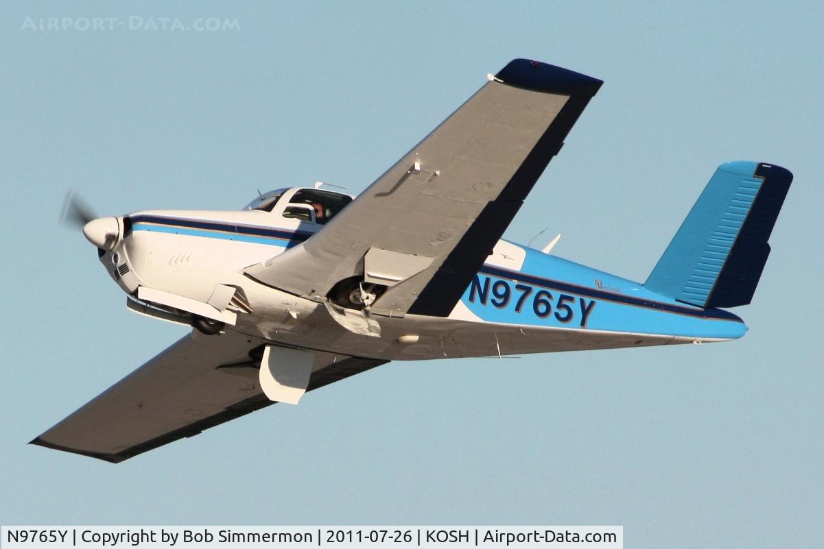 N9765Y, 1963 Beech P35 Bonanza C/N D-7151, Departing Airventure 2011.