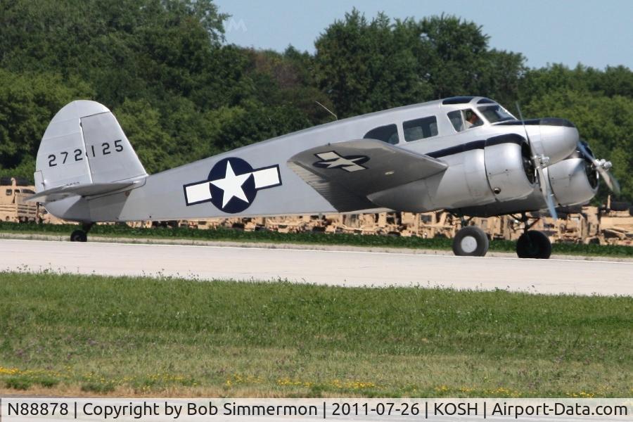 N88878, 1943 Cessna UC-78C (T-50) Bobcat C/N 4121, Departing RWY 18 during Airventure 2011.