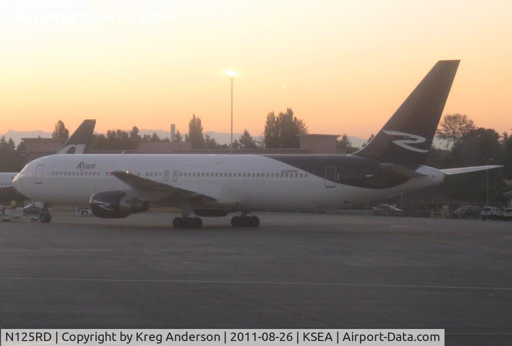 N125RD, 1990 Boeing 767-383/ER C/N 24849, Ryan International Airlines Boeing 767-383ER being towed to a gate.