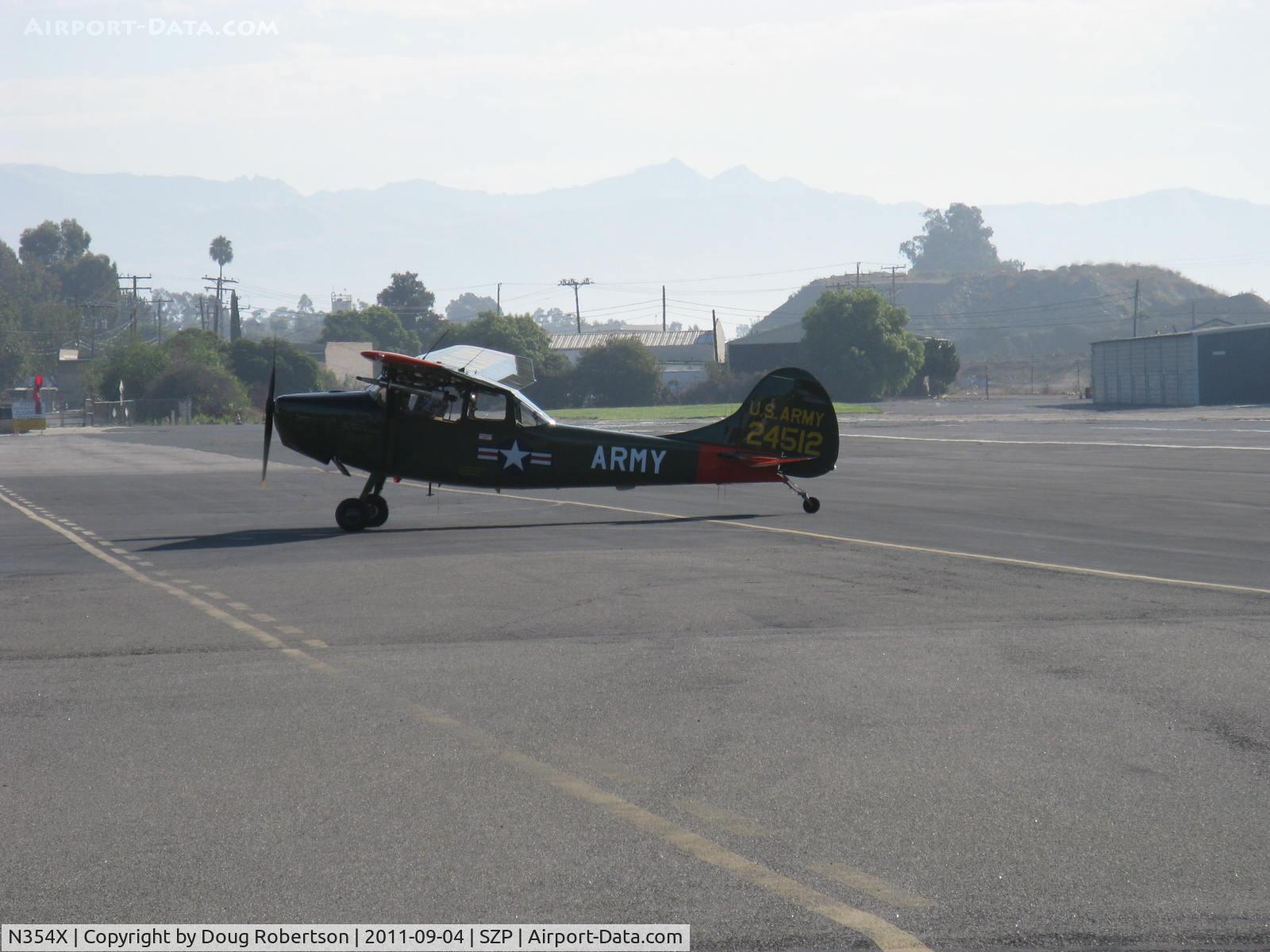 N354X, 1957 Cessna L-19E Bird Dog C/N 24512, 1957 Cessna L-19E BIRD DOG, Continental O-470-11B 213 Hp, taxi to refuel after STOL landing Rwy 22