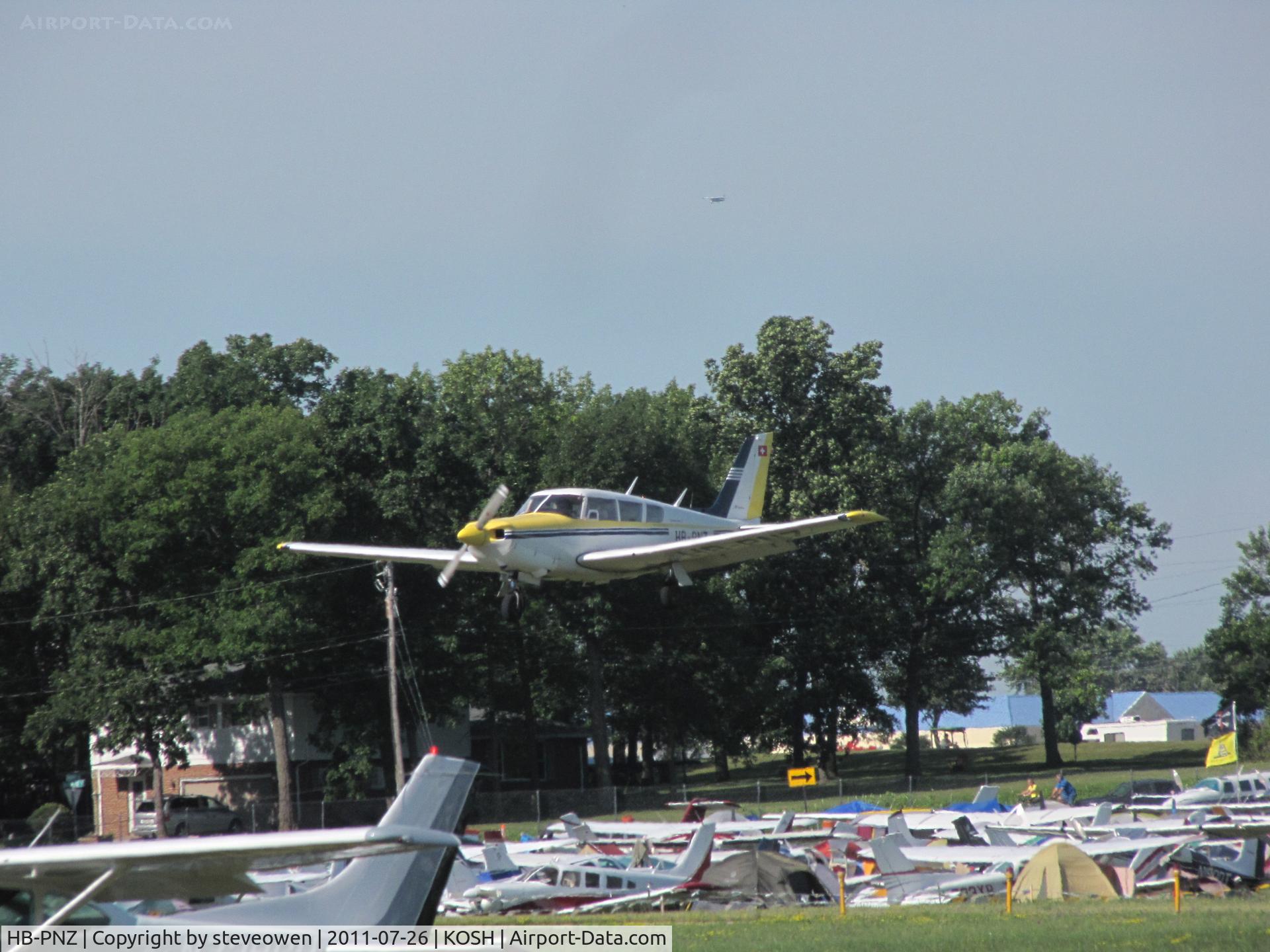 HB-PNZ, 1970 Piper PA-24-260 Comanche C/N 24-4934, Landing runway 09  EAA Oshkosh 2011