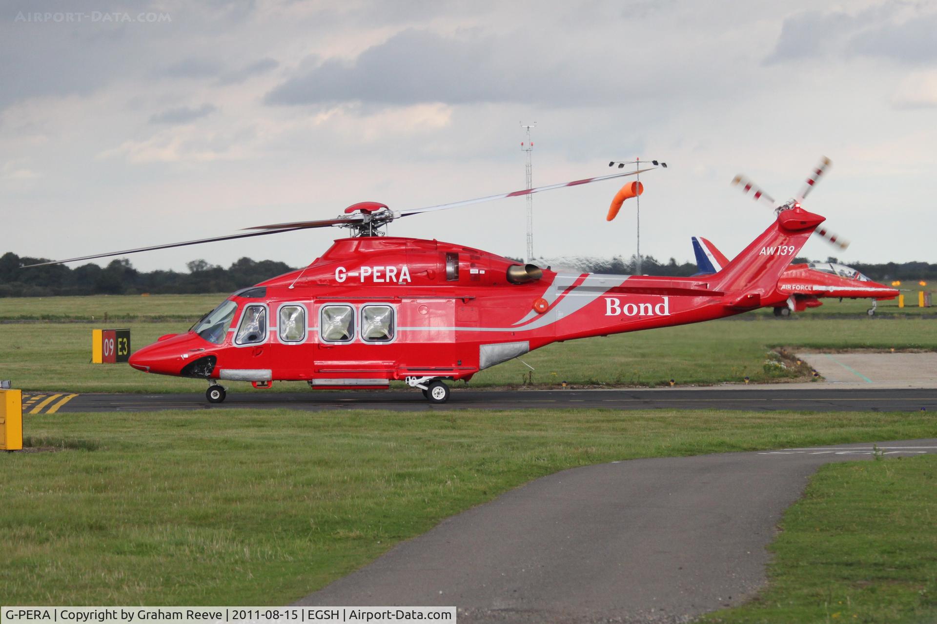 G-PERA, 2010 AgustaWestland AW-139 C/N 31322, With one of the red arrows in the back ground.