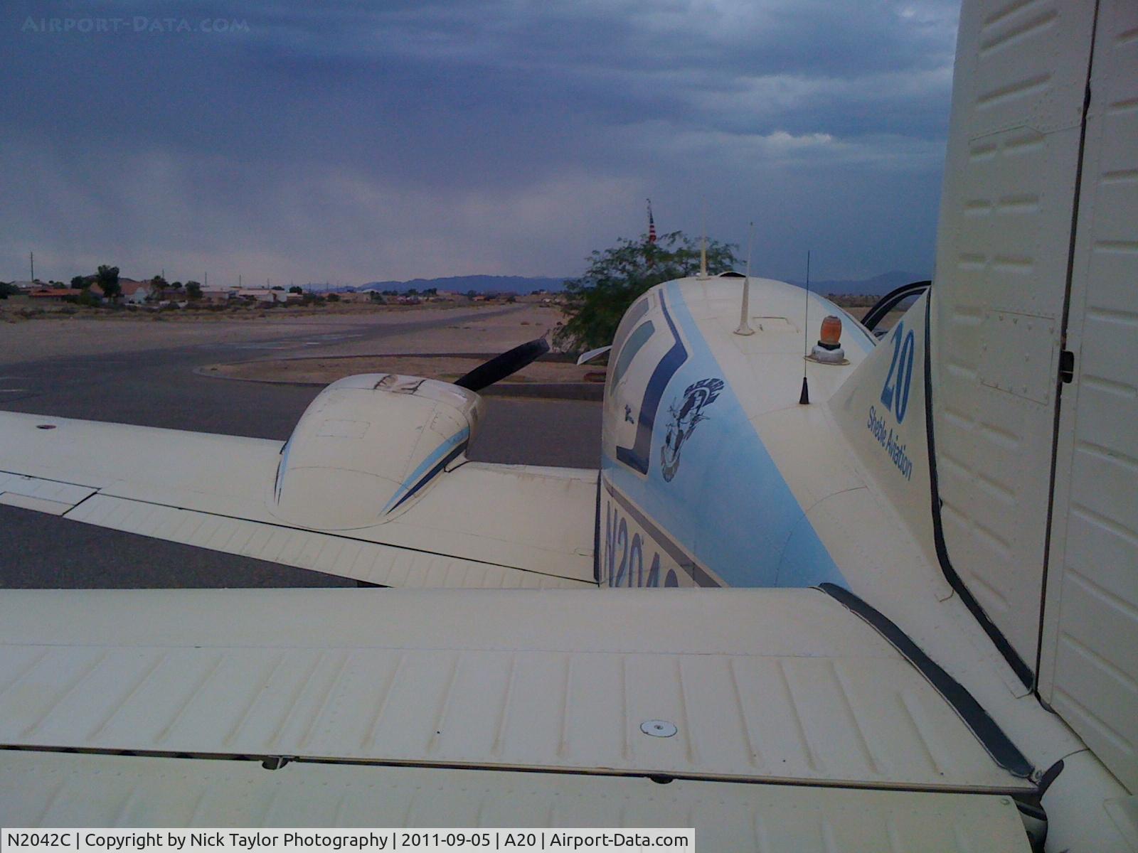 N2042C, 1959 Beech 95 Travel Air C/N TD-219, Storms to the south would soon pass.