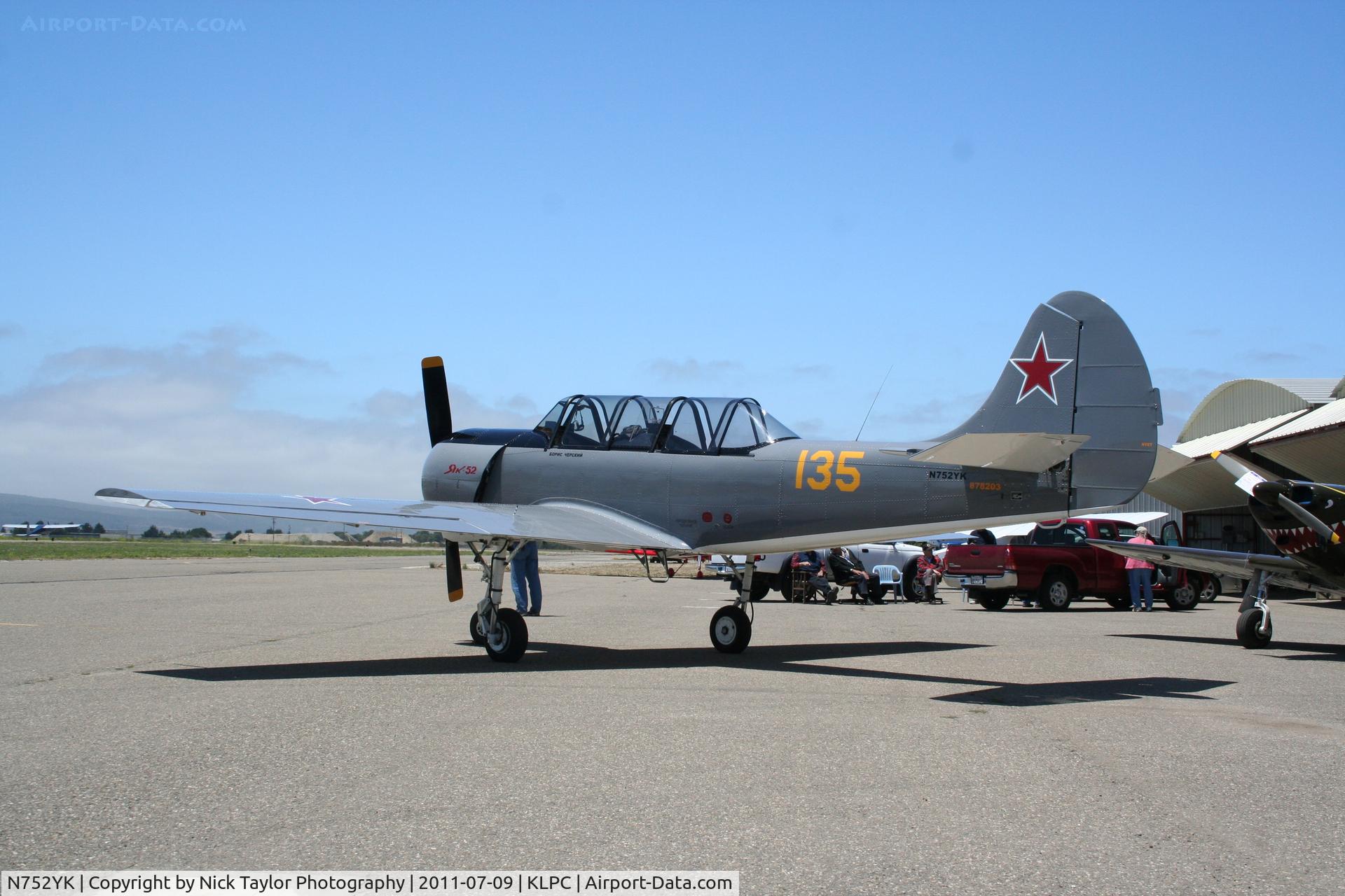 N752YK, 1987 Yakovlev Yak-52 C/N 878203, Lompoc Piper Cub fly in 2011