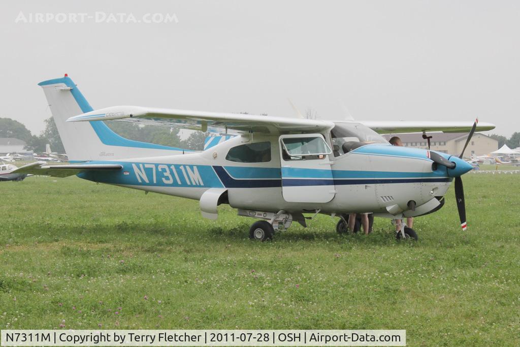 N7311M, 1977 Cessna T210M Turbo Centurion C/N 21062007, Aircraft in the camping areas at 2011 Oshkosh