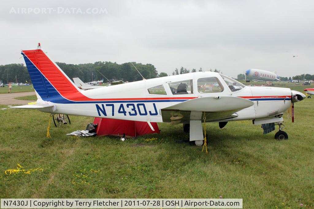 N7430J, 1968 Piper PA-28R-180 Cherokee Arrow C/N 28R-30774, Aircraft in the camping areas at 2011 Oshkosh