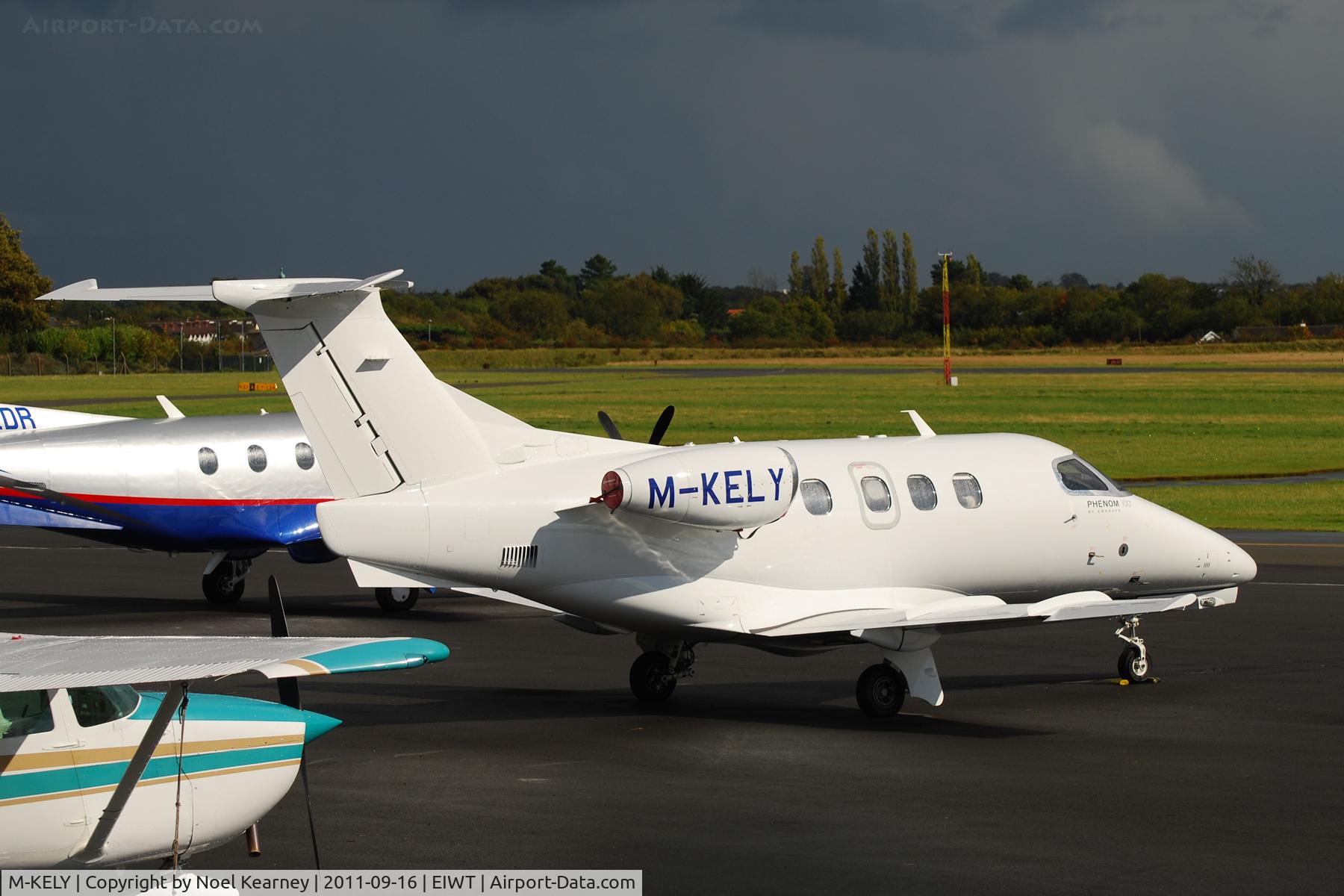 M-KELY, 2009 Embraer EMB-500 Phenom 100 C/N 50000040, Parked on the apron at weston.
