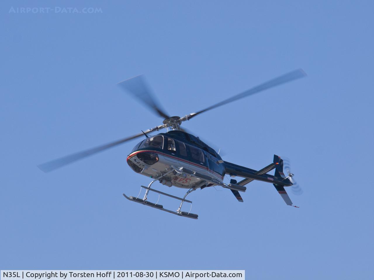 N35L, 2000 Bell 407 C/N 53402, N35L arriving on RWY 21