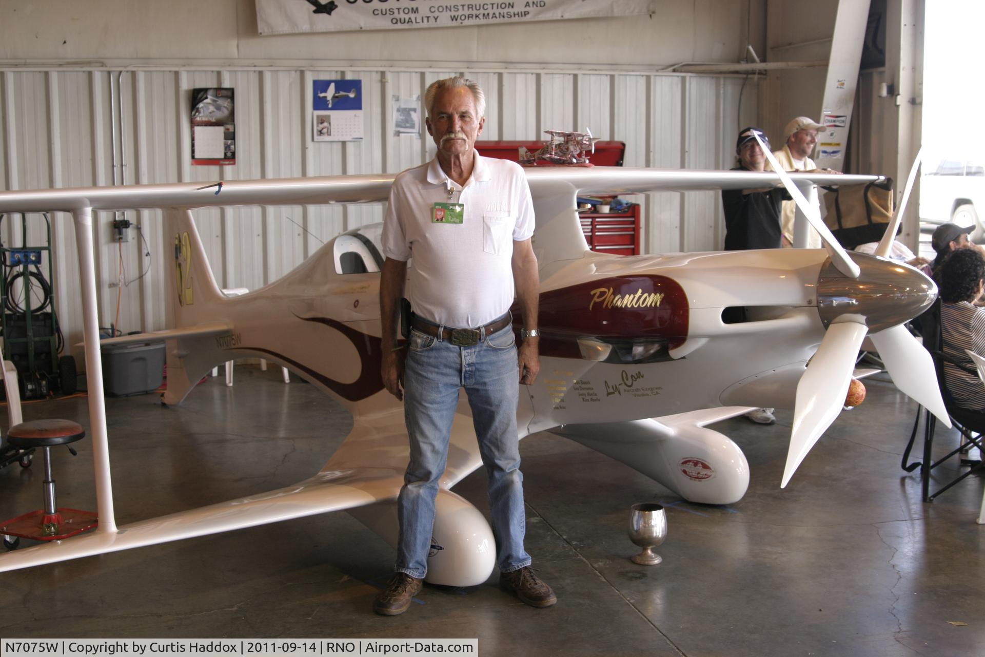 N7075W, Mong Sport Mod C/N ACA-6BA, Tom Aberle with his Modified Mong Sport Bi-plane in the hangar at the 2011 Reno Air Races