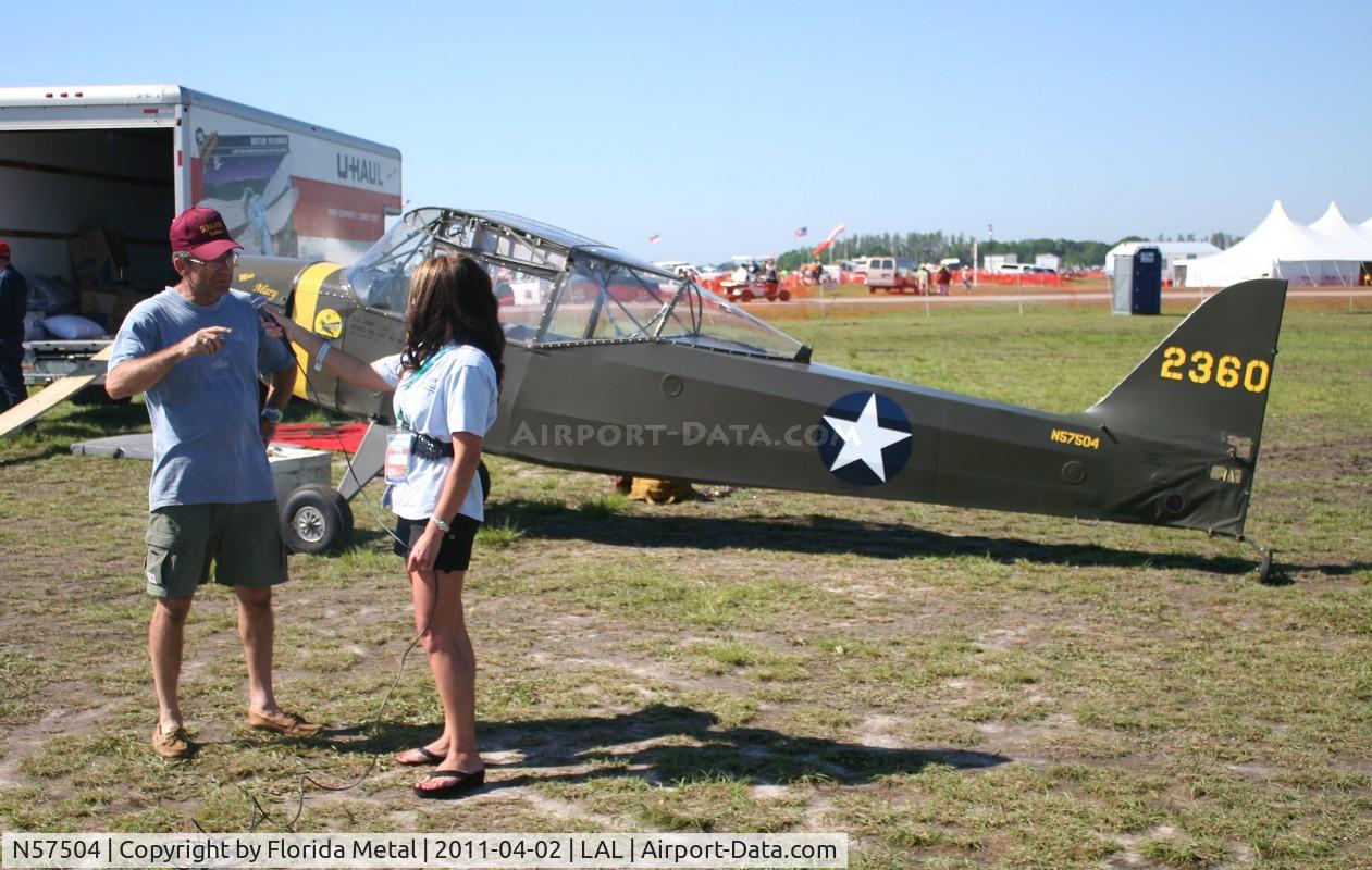 N57504, 1942 Taylorcraft DCO-65 C/N 0-4466, Reporter interviewing owner of storm damaged L-2.

Reporter:  
